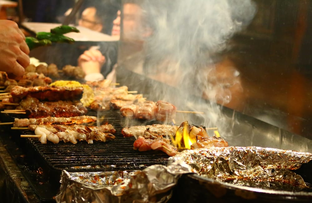 Skewers smoking on the grill